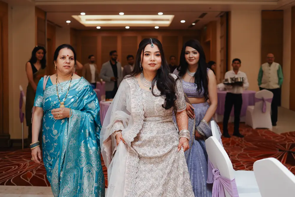 Bride walking into her engagement ceremony alongside her mother, photographed by EDP Studio in Lucknow